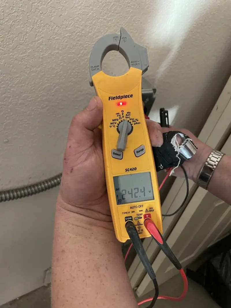 Voltage testing with clamp meter during Outlet Installation in Norwich
